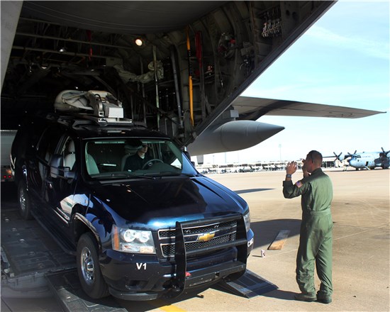 Members of the National Guard's 6th Weapons of Mass Destruction Civil Support Team, headquartered at Camp Mabry, in Austin, Texas, and members of the Texas Air National Guard's 136th Airlift Wing, headquartered at Naval Air Station Fort Worth Joint Reserve Base, Texas, load a military vehicle onto a C-130 Hercules, assigned to the 136th Airlift Wing, at NAS Fort Worth JRB, Dec. 5, 2012. 