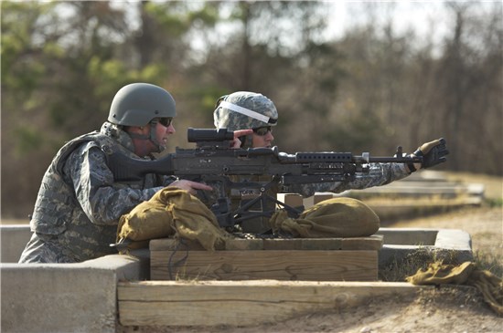 Air Force Lt. Gen. Joseph L. Lengyel, vice chief of the National Guard Bureau, receives training from Sgt. 1st Class Kyle York, a member of the Texas Army National Guard, on a M249 Squad Automatic Weapon during a visit to Camp Swift, near Bastrop, Texas, Jan. 23, 2013.