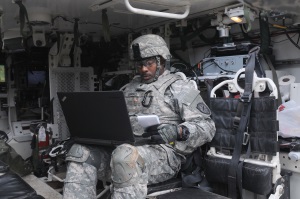 Photo of soldier on laptop