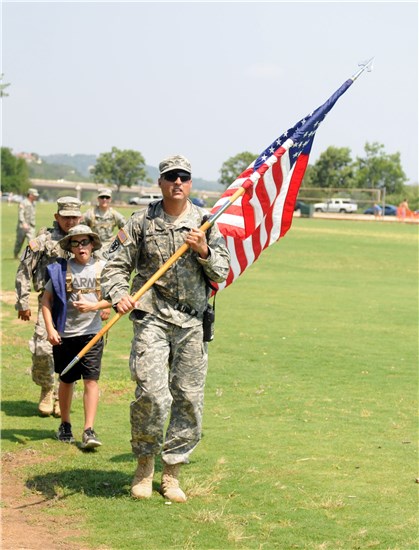Texas Military Forces, service members, families and local civilians participate in the 5th Annual March For Fallen Heroes in Austin, Texas, May 28, 2011.