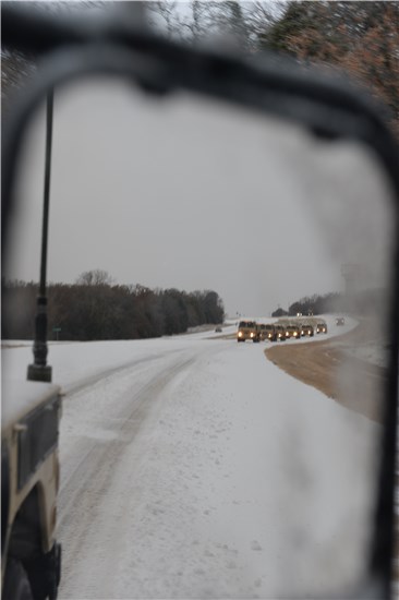 Soldiers from the 236th Engineer Company, 176th Engineer Brigade, Texas Army National Guard, head out to help fellow Texans during Winter Storm Cleon on Dec. 6, 2013. 