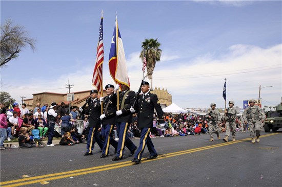 Staff Sgt. Pedro Villareal (2nd from left), along with the color guard detail from 3rd Battalion, 141st Infantry Regiment, Texas Army National Guard, participate at the 2013 George Washington Birthday Celebration Parade in Laredo, Texas, Feb. 23, 2013. 