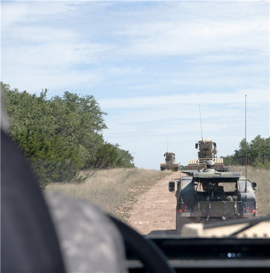 A Buffalo mine-protected vehicle follows along in a route clearance convoy training-mission at Camp Bowie in Brownwood, Texas, June 18, 2013. 