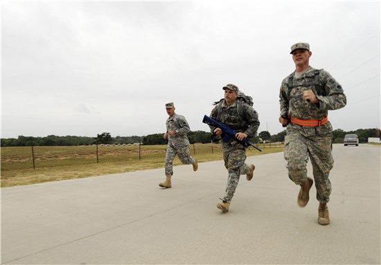 Sgt. Steven Montoya (pictured here with ruck sack), Oklahoma Army National Guard, runs to the finish line in the ruck march portion of the NGB Region V Best Warrior Competition held at Camp Swift, Texas, May 7 to 9, 2013. 