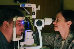 Sgt. Suzanne Carter Air Force Capt. Laura Lokey, an optometrist with 149th Medical Group, 149th Fighter Wing, checks Miguel Gomez's eyes on day four of Operation Lone Star at Manzano Middle School in Brownsville, Texas, Aug. 7, 2014. This was the first year that full vision services were available at the Brownsville medical point of distribution during this annual, five-day, medical and emergency preparedness exercise. More than 600 patients received eye exams and prescription glasses through Remote Area Medical, the Knoxville, Tenn.-based organization that provides the equipment for the exams and fills glasses prescriptions on-site, and Texas Military Forces during Operation Lone Star 2013. (U.S. Army National Guard photo by Sgt. Suzanne Carter/Released)