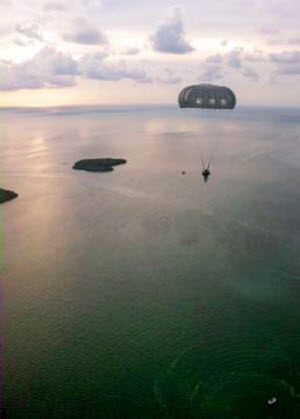 Courtesy Photo  A Texas Army National Guardsman with Special Operations Detachment - Africa, 71st Troop Command, jumps into the waters off of Key West, Fla., July 24, 2015. The jump, was part of a long-range, airborne water insertion and a culmination of three years of planning with active duty Army Special Forces, Air Force, Navy and U.S. Coast Guard to ensure that SOD-A always has trained and deployable personnel to conduct the many real world missions it is called upon to execute. (Courtesy photo by Special Operations Detachment - Africa)