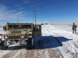 A soldier from 2nd Battalion, 142nd Infantry Regiment, 56th Infantry Brigade Combat Team, 36th Infantry Division, Texas Army National Guard responds to the southwest blizzard in the Texas Panhandle.