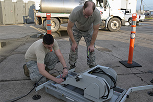 Left, Senior Airman Jeremy Vance, right, Tech Sgt. Christopher Dorriott, set up a mobile sattelite dish as part of the Texas Interoperability Communications Package, during a Hurricane evacuation exercise in the Lower Rio Grande Valley, June 7 -10, 2016. The TICP provides commincation capabilities for the command and control center during emergency disasters. (Photo by U.S. Army National Guard Sgt. Elizabeth Pena/Released)