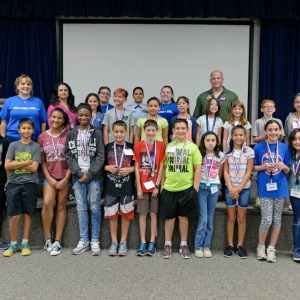 STARBASE Houston students pose with instructors and 147th Reconnaissance Wing Commander Col. Stan Jones at the end of the location's weeklong STEM camp at Ellington Field July 22, 2016. About 20 students attend the STEM camp. Starbase is a Department of Defense program to motivate students to explore science, technology, engineering, and math. (U.S. Air National Guard photo by 1st Lt. Alicia Lacy)