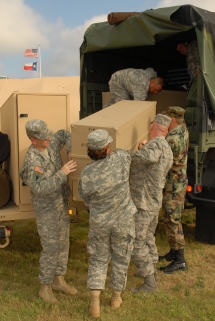 Members of the Texas Army and Air National Guard and Texas State Guard unload supplies to prepare for rescue and relief efforts in response to Hurricane Dolly next to the Emergency Operations Center at Brooks City-Base in San Antonio, Texas July 23. Photo by Air Force Tech. Sgt. Elisabeth A. Matulewicz