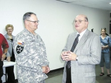 Brownwood Mayor Bert Massey, right, welcomes Maj. Gen. Christopher J. Powers, commanding general of the Texas State Guard, to Brownwood Friday during a reception at Adams Street Community Center. More than 200 members of the Texas State Guard will be training at Camp Bowie over the next two weeks. Photo by Gene Deason