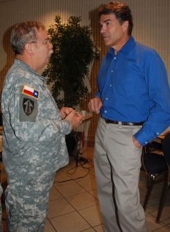 Governor Rick Perry discusses TXSG operations with BG Victor M. Ortiz Jr. during recent hurricane activation.Photo by MAJ Michael Spraggins