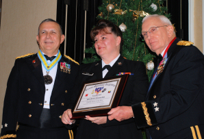 Major General Jose S. Mayorga (left) Adjutant General of Texas and Major General Raymond C. Peters (right) Texas State Guard Commanding award PO1 Michelle Gish TXSG Maritime Regiment two awards; 2009 Junior Enlisted of the Year, and the Texas Medal of Merit for lifesaving actions while on TXSG hurricane shelter duty during Hurricane IKE.