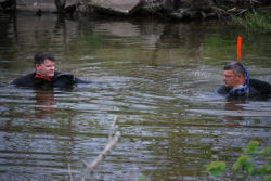 Sgt. Corey Lewis, of Plano, and Petty Officer Carl Clary, of Madisonville, conduct a side-by-side search of Lake Houston waters in an effort to recover aircraft debris during a training exercise April 10. Both are members of the Texas State Guard Maritime Regiment (TMAR) 1st Battalion Rescue Dive Team.