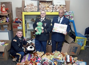 (L to R) MAJ Christopher Sauceda, SGT Johnny Gately, and SrA Rheuben Towne present some 1,300 toys to the Dell Children’s Hospital on behalf of the soliders of the TXSG.
