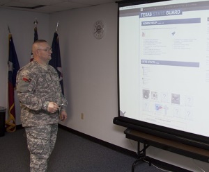 Photo of SGT Gately presenting the new website