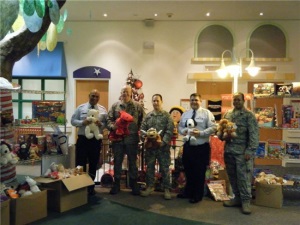Group Photo with a large amount of toys in boxes