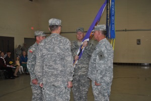 Photo: (Credit-SSG Malana Nall) LTC Buddy Grantham holds the regimental colors after accepting command of the 8th Regiment from Brigadier General Jake Betty