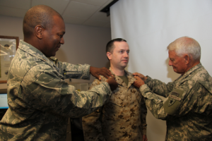 Members of the Del Rio JOIC stood in formation as Col Hamilton and Maj Kali Pinckney, Commander of the 449th ASG, pinned on his new rank.   Col Hamilton explained, “I’m pleased to promote CPO Gilbert to SCPO.  Chief Gilbert began his TXSG career with the Army side, later when TMAR stood up, he transferred to that component.” 