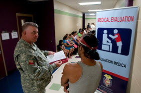 Sgt. William Alford, Tyler Medical Response Group, Texas State Guard assists with the flow of patients during Operation Lone Star 2013 in Brownsville, TX. Operation Lone Star serves as the only access to medical care that residents of the South Texas Border Region have to medical care or doctors. (U.S. Army National Guard photo by Spec. Aaron Moreno.)