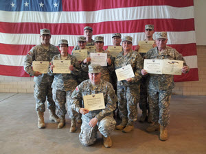 Warrior Leadership Course Graduates on April 27, 2014 (left to right) PFC Anthony Rose, PFC Lynda Briggs, CPL Bailey Phillips, CPL Hans Hansen, PFC Sylvia Maza, PFC Adrian Washburn (kneeling), SGT Gayle Linke, PFC Tessa Smith, PFC Erick Schluter, and SPC Colin O’Brien. Photo by CW2 Janet Schmelzer, 4th Regiment PAO.