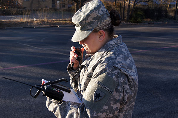 Pfc. Kristin Galaviz, 2nd Regiment, Texas State Guard, practices radio communication during a points of distribution exercise at the First Presbyterian Church in Stephenville, Texas, January 23, 2016.  Providing food and water distribution points is a skill that the Texas State Guard can provide to assist local residents during an emergency. (Photo by Spc. Stefan Wray, 2nd Regiment/Released)