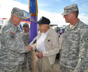 Col. Edwin Grantham, Commander, and Command Sgt. Maj. John Marshall, Senior Enlisted Advisor, 8th Regiment, Texas State Guard, present a regimental challenge coin to World War II veteran Col. Richard “Dick” Cole, during a ceremony at the 32nd Annual Wings over Houston Air Show at Ellington Field Joint Reserve Base, Houston, Oct. 22-23, 2016.   Cole is the last surviving member of the Doolittle Tokyo Raiders and was co-pilot to Gen. Doolittle during the famous raid on Tokyo during World War II.  (Texas State Guard photo by Warrant Officer Malana Nall) 