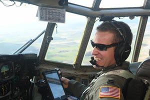 1st Lt. Chad Douglass, 181st Airlift Squadron C-130H2 Hercules co-pilot, mans the controls above the Polish countryside during a formation flight with the Polish Air Force on March 13, 2019. 136th Airlift Wing members travelled to Poland in support of Aviation Rotation 19.1 in an effort to increase threat response capabilities with the Polish Air Force. (Air National Guard Photo by Staff Sgt. Sean Kornegay/released)