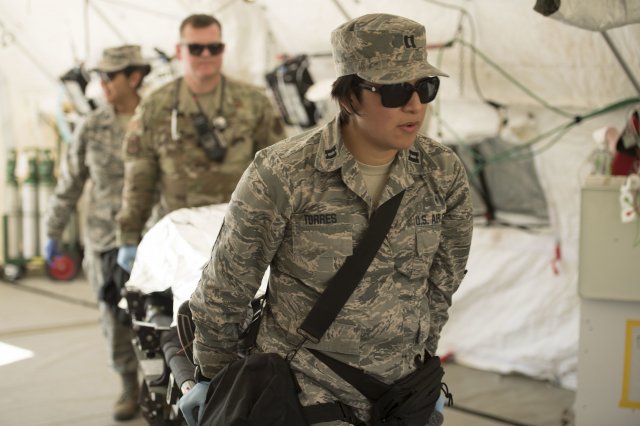 Capt. Gabriela Torres, a trauma nurse assigned to the 149th Medical Det-1, simulates providing medical treatment during the Texas National Guard's 6th CERFP Task Force response evaluation exercise Dec. 7, 2019, in Round Rock, Texas. (Photo Credit: Tech. Sgt. Agustin Salazar)