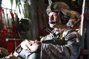  U.S. Army Lt. Col. Max Krupp, commander of the 1st Battalion, 143rd Infantry Regiment (Airborne), Texas Army National Guard, prepares to jump out of a C-130J aircraft flying over the Black Hills of South Dakota, during Golden Coyote training exercise, June 7, 2015. Golden Coyote gives service members from all over the country and world an opportunity to train on their skills. (U.S. Army photo by Spc. Bryant Abel/Released)