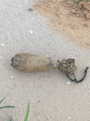 Courtesy Photo  Texas-based Army engineers unearthed an 81-millimeter mortar round during a multi-component range road project, July 12, 2015. Active-duty soldiers from the 79th Ordnance Disposal Battalion, 71st Ordnance Group based in Fort Hood, Texas responded and detonated the mortar using C4 explosives. The 17-mile roadway construction is a 25 day project, 6-30 July, along the perimeter of the Camp Bowie Training Center in Brownwood, Texas. (U.S. Army National Guard Photo Courtesy of 111th Engineer Battalion)