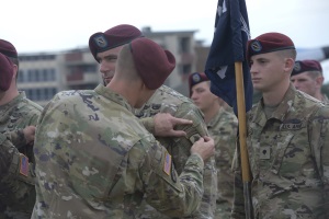 Photo of Ceremony when the patch being placed onto the uniform.