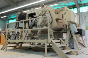 Photo By Sgt. Adrian Shelton | An instructor rushes to assist Soldiers in exiting a simulated rolled over vehicle during HMMWV Egress Assistance Training (HEAT) at the Observer Coach Trainer Academy, at Operation Swift Response at JMRC, Hohenfels Training Area in southeastern Germany, June 10, 2016. HEAT teaches Soldiers how to react and survive in the event of a vehicle rollover event. Exercise Swift Response is one of the premier military crisis response training events for multi-national airborne forces in the world. The exercise is designed to enhance the readiness of the combat core of the U.S. Global Response Force -- currently the 82nd Airborne Division's 1st Brigade Combat Team -- to conduct rapid response, joint-forcible entry and follow-on operations alongside Allied high-readiness forces in Europe. Swift Response 16 includes more than 5,000 Soldiers and Airmen from Belgium, France, Germany, Great Britain, Italy, the Netherlands, Poland, Portugal, Spain and the United states and takes place in Poland and Germany, May 27-June 26, 2016. (Photo by U.S. Army National Guard Sgt. Adrian Shelton)