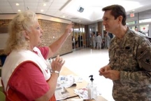 SHELTER FROM THE STORM: Texas State Guard Chaplain Lt. Col. Billy Corn coordinates with Shelia Dawson, shelter manager, of the American Red Cross in Tyler on Aug. 28 at Harvey Convention Center.Ms. Gilbert smiled again as she looked at Texas State Guard troopers who were tidying up from Gustav.Photo by Staff Photo By Jaime R. Carrero, Tyler Morning Telegraph
