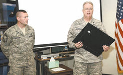 Brig. Gen. Bob Cheeseman (right), Texas State Guard Air Division commander, presents the Texas Meritorious Unit Award to Chief Master Sgt. Albert McGowan, Robert D. Gaylor NCO Academy Commandant. The academy was recognized for offering a comprehensive and professional program tailored to the needs of the Texas State Guard NCO Corps.Photo by Robbin Cresswell