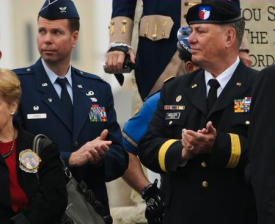 Brig. Gen. Charles A. Miller, chief of staff for the Texas State Guard, Col. Donald Prince, commander of the 5th Air Wing Texas State Guard, applaud during the International Bridge Ceremony. Prince helped organize the George Washington Birthday Celebration, a traditional event in Laredo. Texas Military Forces often support community events such as this one.Photo by 100th Mobile Public Affairs Detachment, Army National Guard Pfc. Paco Pineda