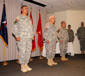 Photo of Commanding General Ray Peters (Center) promoted Manuel Rodriguez, left, to Brigadier General and Deputy Commanding General, Army. Rodriguez takes over from retiring BG Victor Ortiz (right).