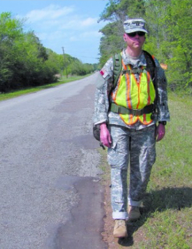 Photo of Capt. Allen Rush walking next to the road
