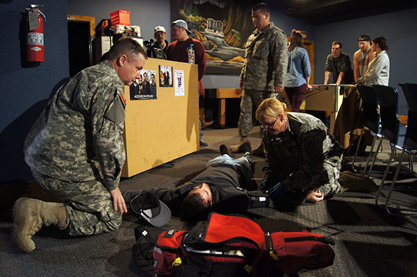 Sgt. Susan Simmons, 2nd Regiment, Texas State Guard, checks the blood pressure of a role player in a mock exercise at the mass care shelter at the Valley Grove Baptist Church, Stephenville, Texas, January 22, 2016. Mass care sheltering is a skill that the Texas State Guard can provide to assist local residents during an emergency. (Photo by Spc. Stefan Wray, 2nd Regiment/Released)