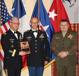 Texas State Guard Staff Sgt. Gregory Illich, 8th Regiment, Army Component, was recognized as  the Texas State Guard Outstanding Non-Commissioned Officer of the Year 2018 and awarded the Texas Outstanding Service Medal by Texas State Guard Commander Maj. Gen. Robert Bodisch, and Command Sgt. Maj. Bryan Becknel during a ceremony held at the Texas State Guard holiday gala in San Marcos, Texas, December 8, 2018.  He was also recognized as the Texas State Guard Army Component Outstanding Non-Commissioned Officer of 2018 and received “Sgt. Maj. Hiram J. Williamson Award for Service Excellence.”  (Texas State Guard photo by Cpl. Shawn Dromgoole)